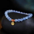 Women's ice translucent aquamarine crystal bracelet with 8mm round beads and blessing card detail
