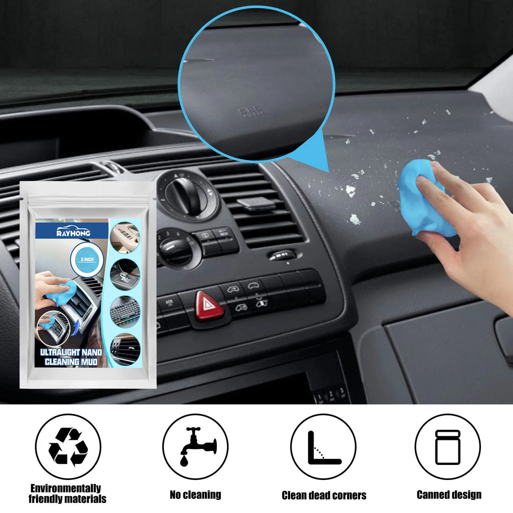 Piece of grey car cleaning putty on a car dashboard near air vents.
