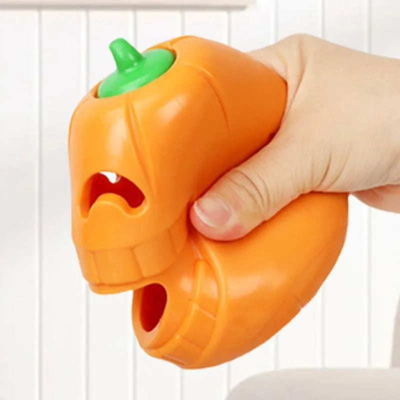 Yellow pumpkin-shaped TPR dog chew toy for aggressive chewers on white background