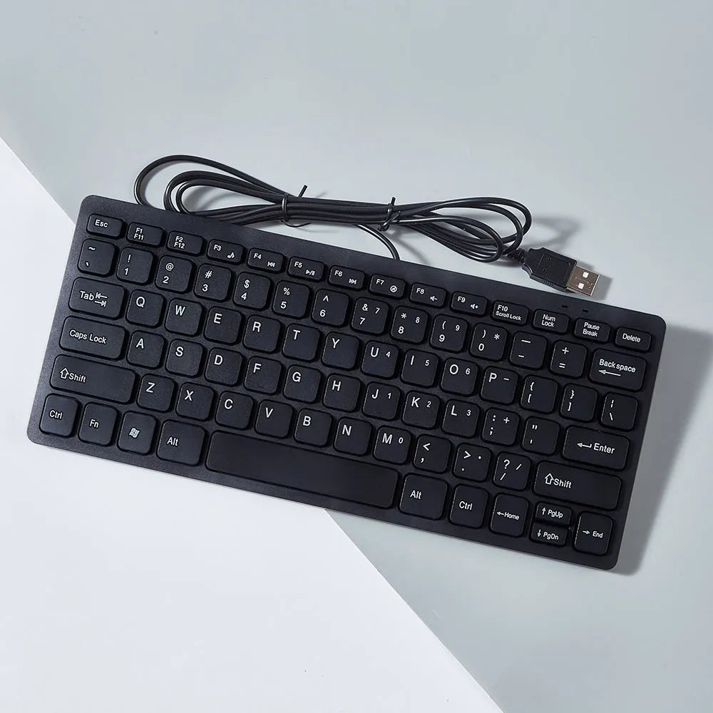 Mini USB wired keyboard for laptops in black, white, pink, or blue colours with 1.3 metre cable