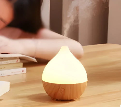 Asakusa wood grain finish vase-shaped aroma diffuser with USB cable on a wooden surface.