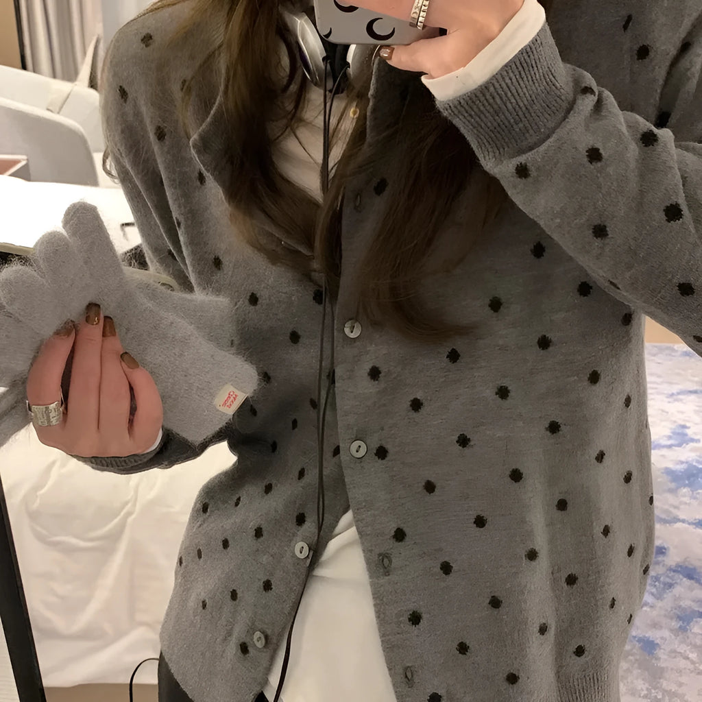 Women's grey Korean-style cardigan with crocheted flower detail on mannequin
