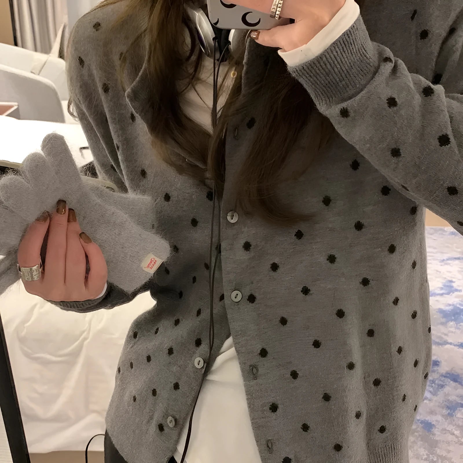 Women's grey Korean-style cardigan with crocheted flower detail on mannequin