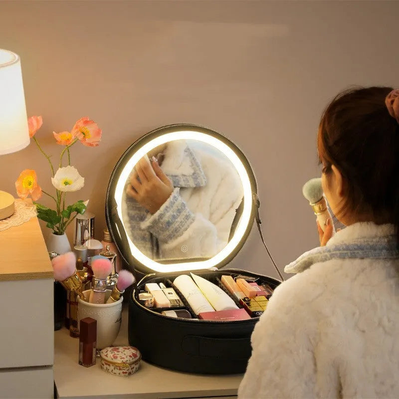 Round smart LED makeup bag with integrated mirror lights in cherry blossom pink colour with lattice partitions visible