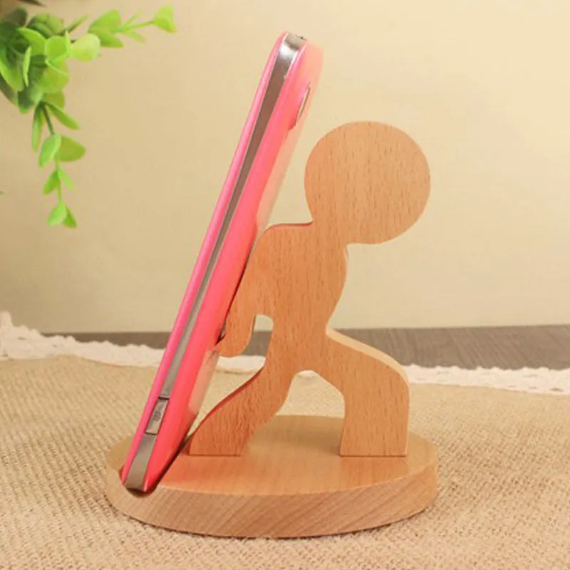 Beech wood and resin lazy bracket mobile phone holder in an animal design style on a desk.
