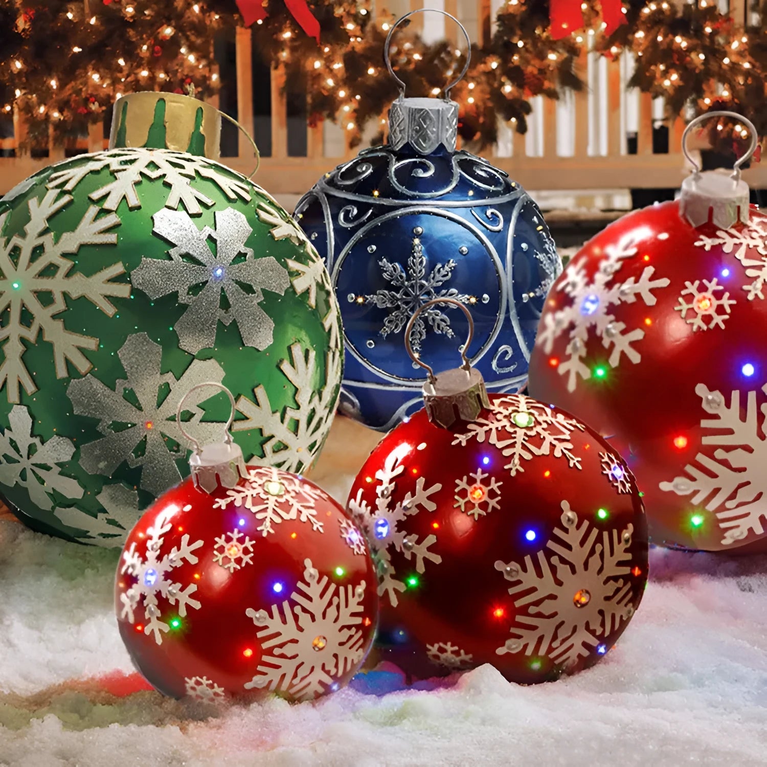 Large red and white striped inflatable Christmas ball ornament hanging on an outdoor tree