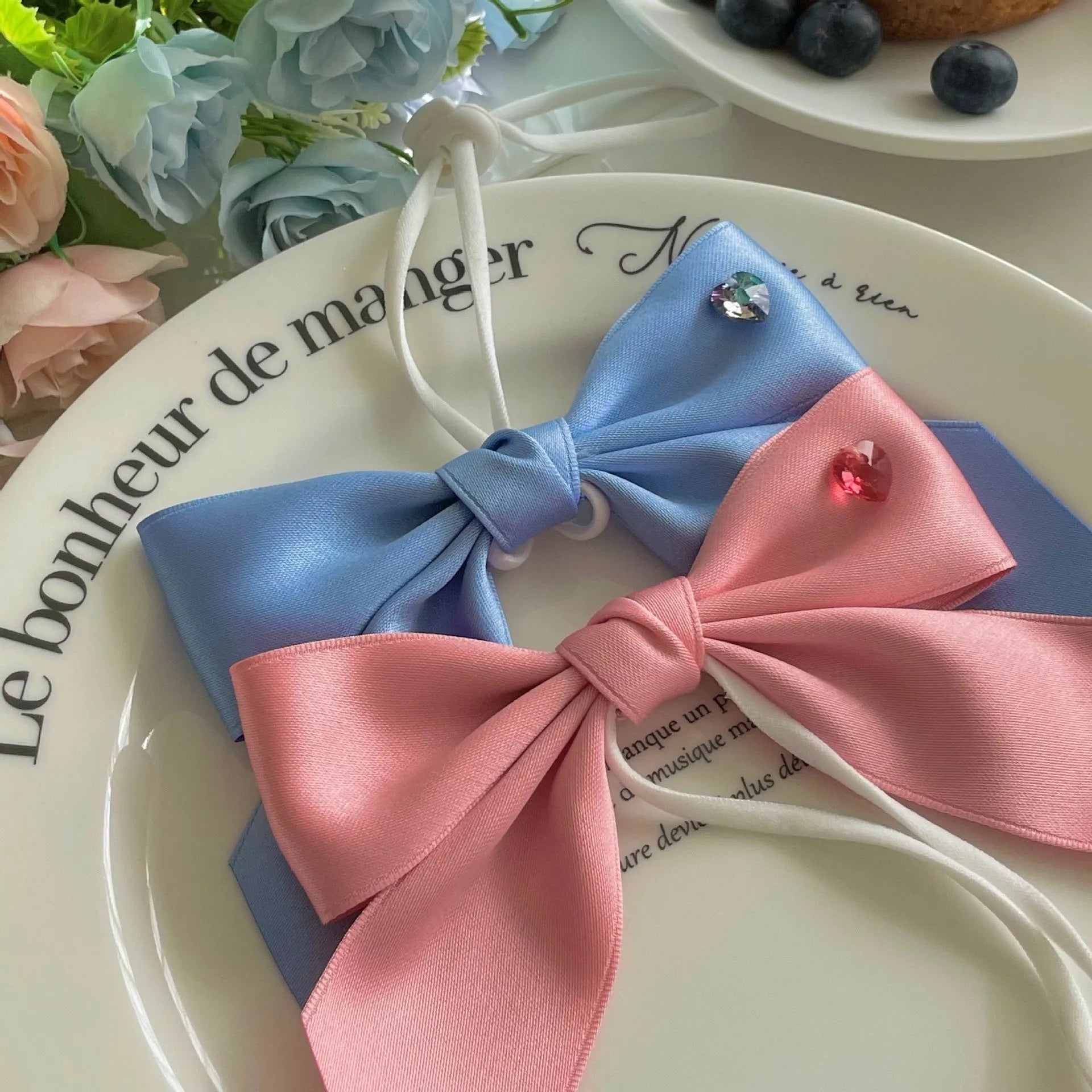 Princess style adjustable bow dog headband in blue colour on small dog