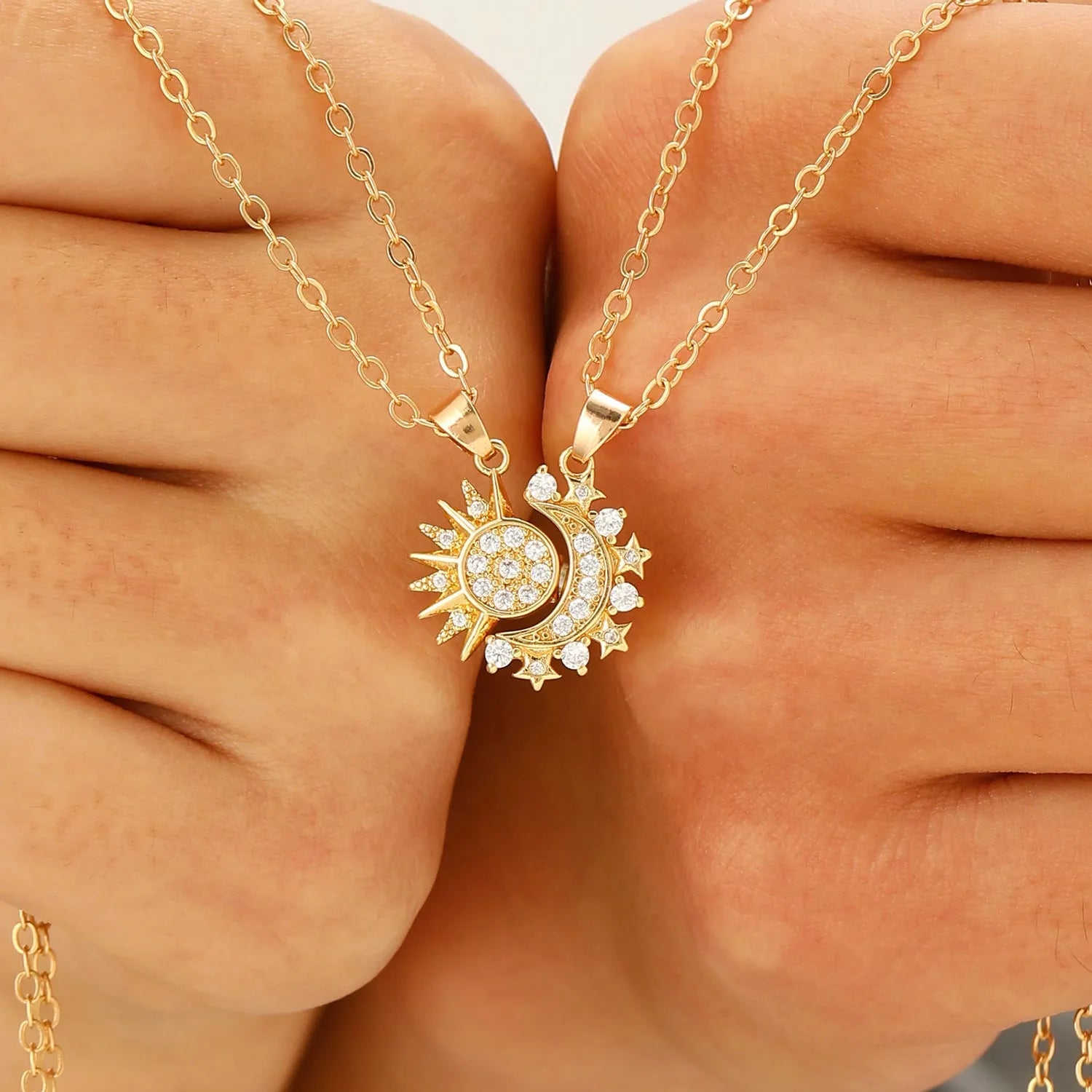 Two copper sun and moon magnetic pendant necklaces on a white background, clavicle chain length, set for couples