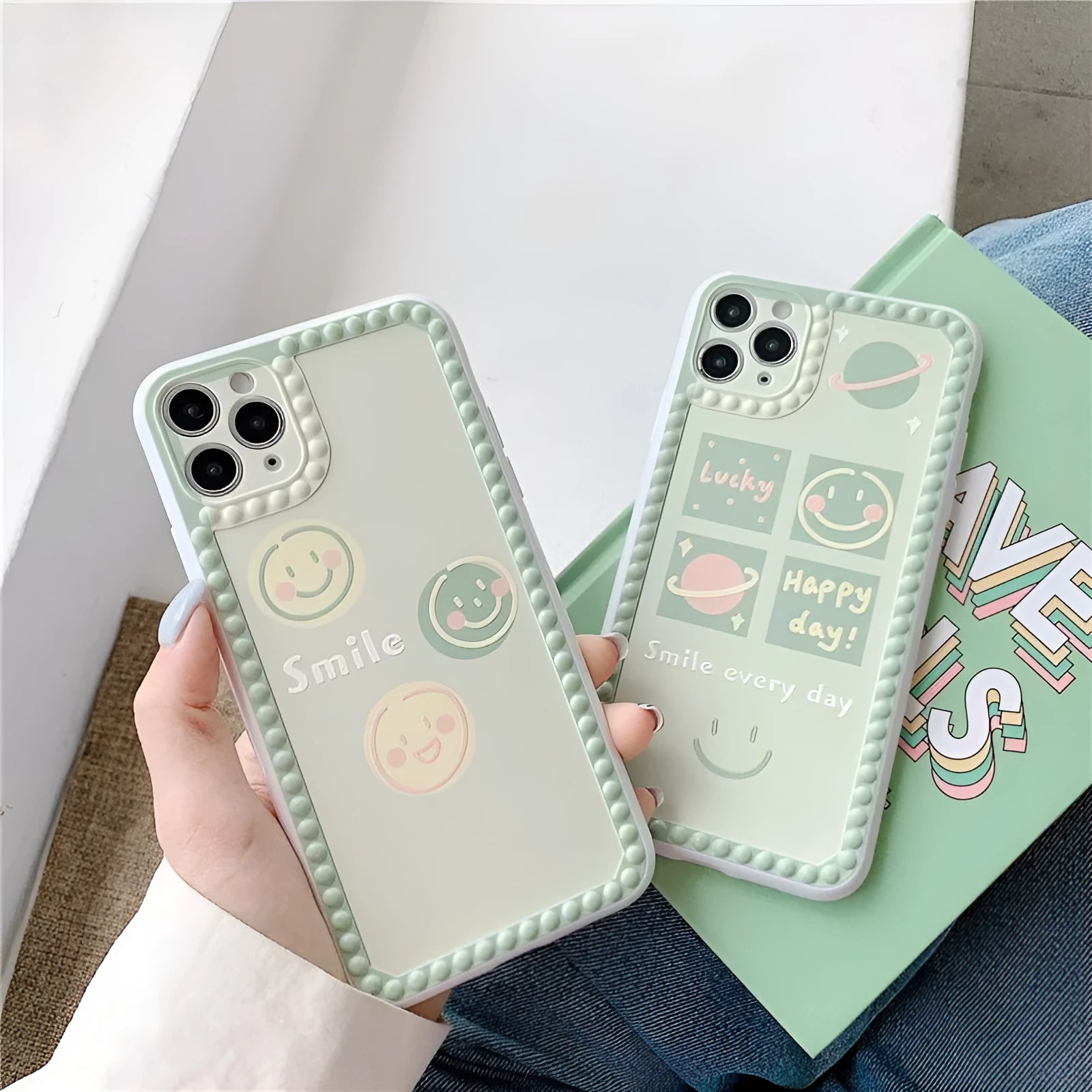 Green TPU iPhone back cover case with geometric smiley face and polka dot frame pattern.