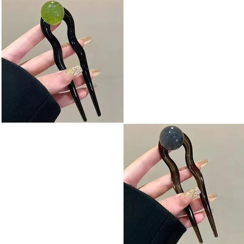 Simple U-shaped acrylic barrettes with ball retro design in beige, caramel, dark gray and green colours