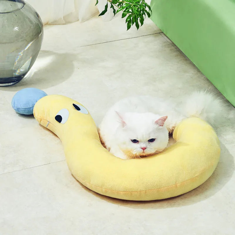 Blue rectangular pet sleeping pillow for cats and dogs on a floor, measuring 62cm by 39cm.