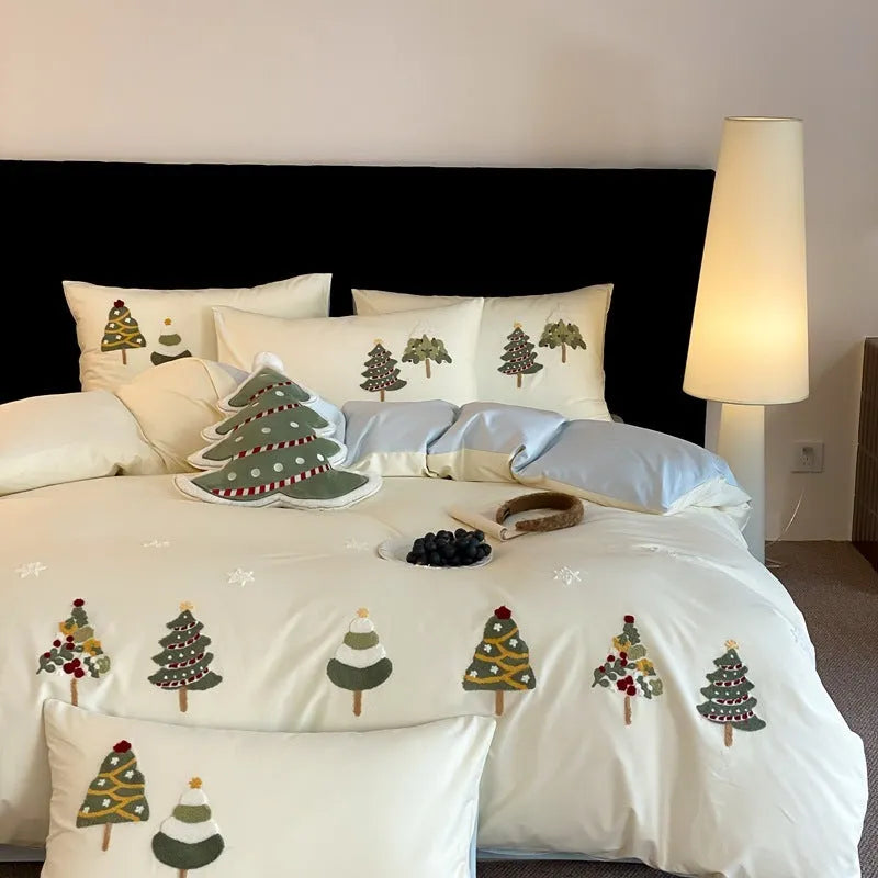 Pure cotton four-piece bed set with embroidered Christmas tree pattern in cream blue and green colours.