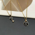 Small alloy lock and key pendant necklace set in black with 40cm chain on white background