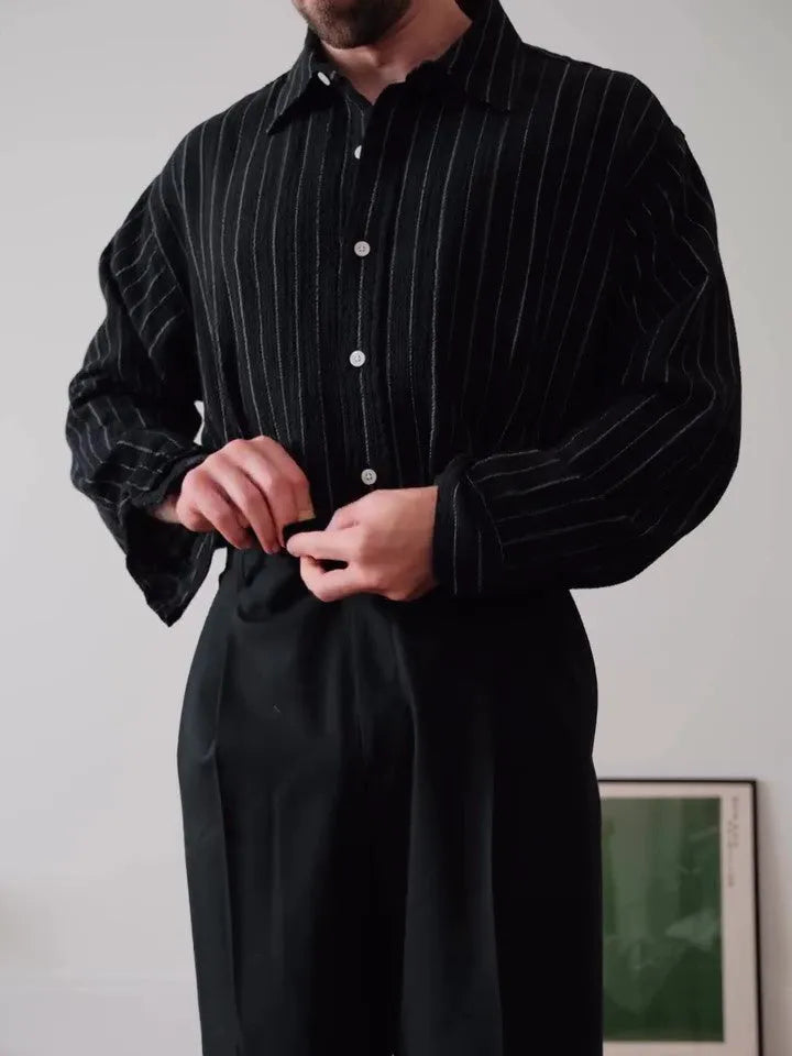 Men's black pinstriped button-down shirt showing regular fit and traditional button-down collar