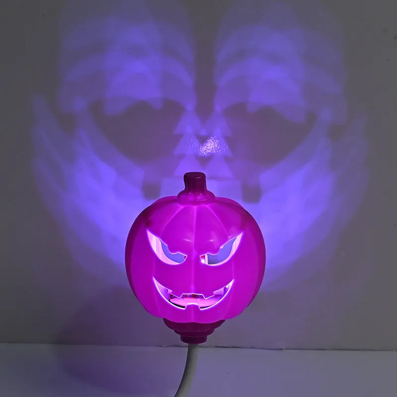 Plastic pumpkin-shaped lamp glowing with either purple or yellow light, measuring 22cm tall.
