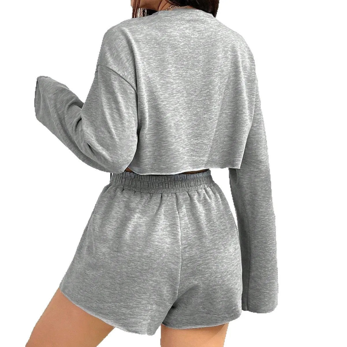 Grey women's long sleeve t-shirt and matching shorts loungewear set laid flat.