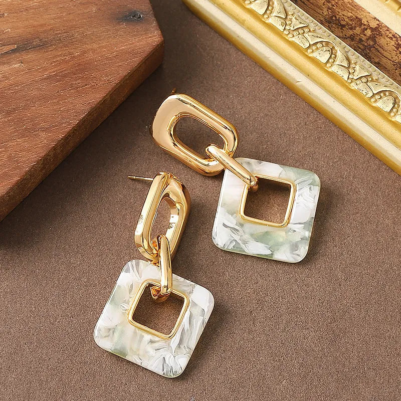 Hollow geometric square earrings with chamfered pattern in electroplated copper