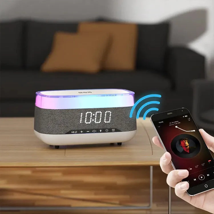 White multifunctional alarm clock with Bluetooth speaker and wireless charging pad display
