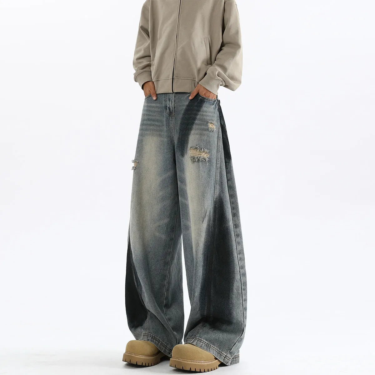 Men's blue ripped jeans with splash-ink wash pattern and loose fit silhouette