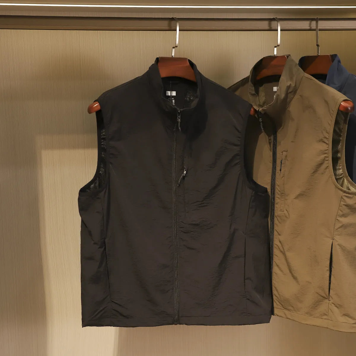 Men's straight fit nylon vest with side seam pockets in black, blue or army green