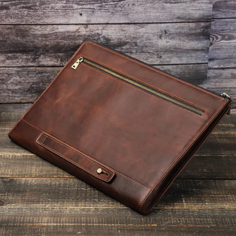 Crazy Horse oil leather laptop bag in coffee colour with zipper closure on white background