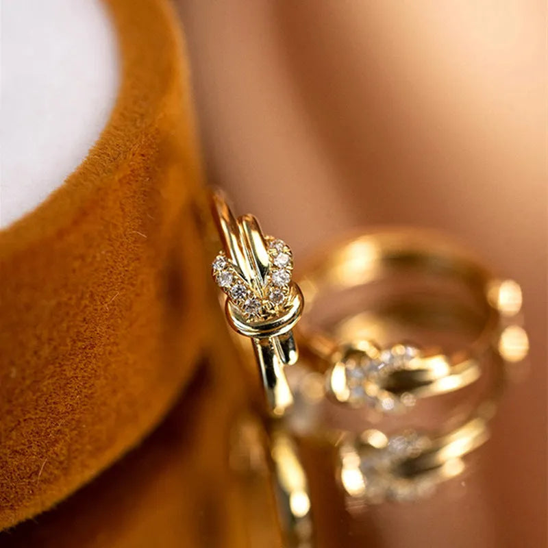 Gold copper vachette clasp earrings for women with geometric inlaid zircon stones and real gold finish