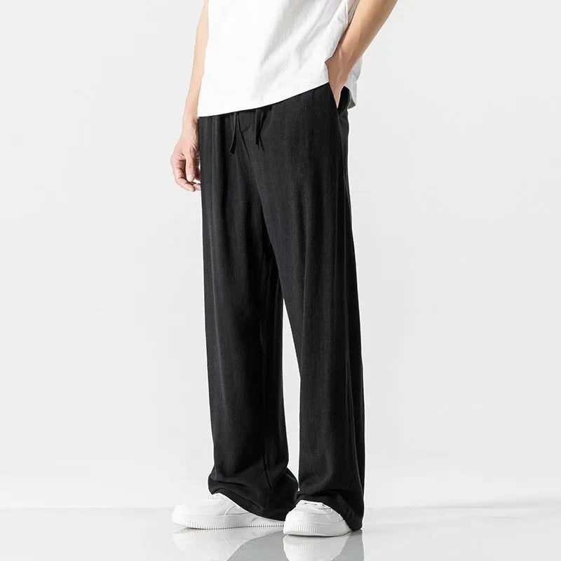 Men's straight-leg casual trousers in beige bamboo fibre fabric with a drawstring waist.