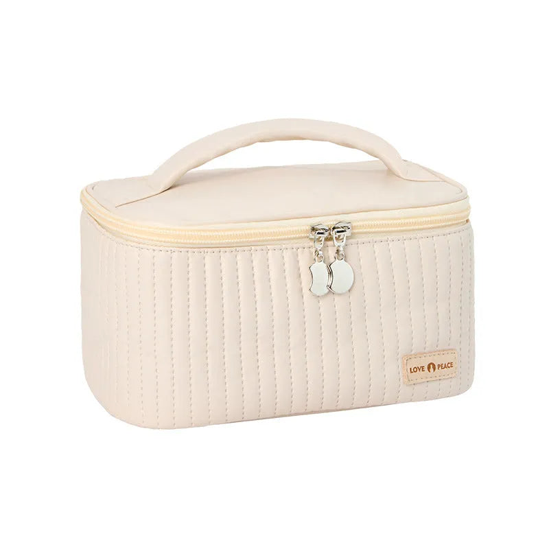Open-top cake-shaped women's makeup bag in PU leather, shown in a soft solid colour.
