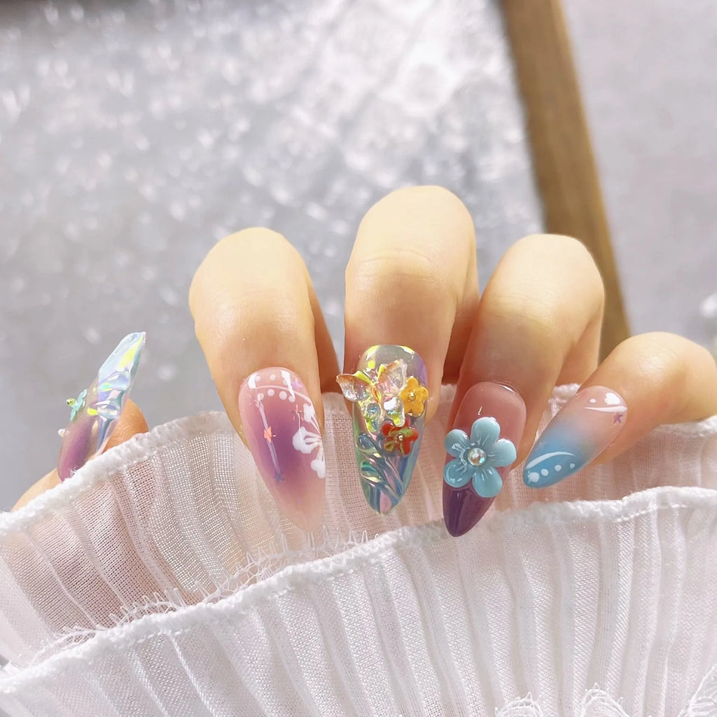Handmade small flower and butterfly nail art charms in assorted sizes for gel manicure decoration.
