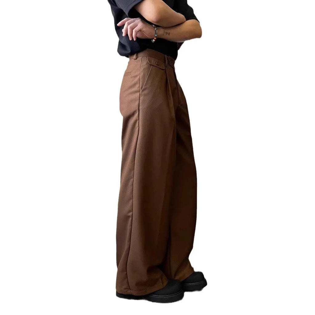 Men's straight-leg wide trousers in brown and black, showing loose fit and casual style.