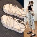 Women's black Roman platform sandals with a round toe strap and textured TPR sole.