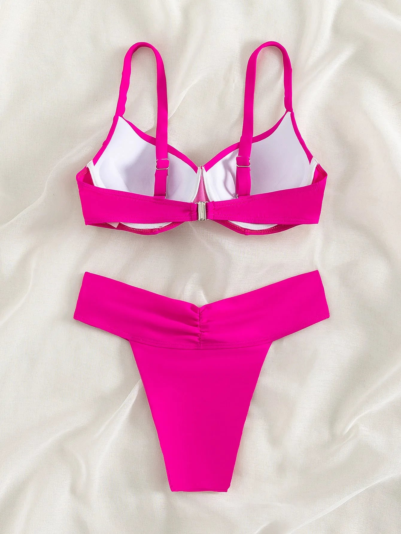 Solid colour two-piece bikini swimsuit in a briefs style on a mannequin.