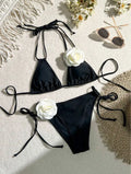 Black women's bikini swimsuit with 3D flower pattern and drawstring lace detailing on two-piece swimwear