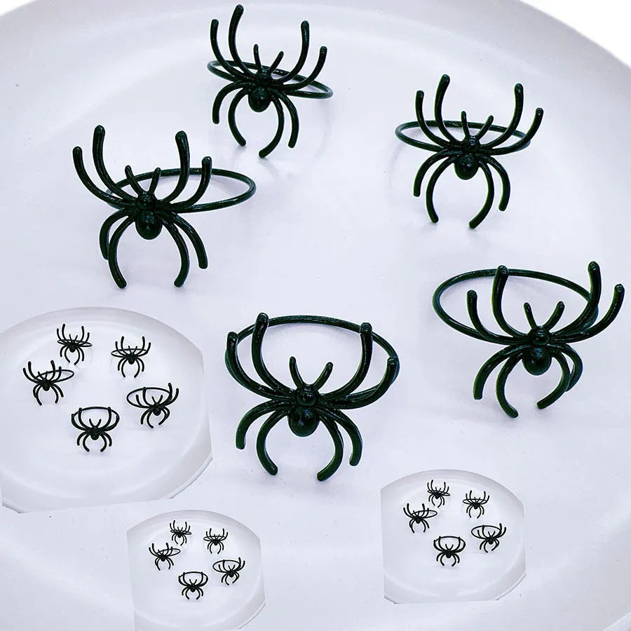 Six black alloy spider napkin rings for Halloween table decoration