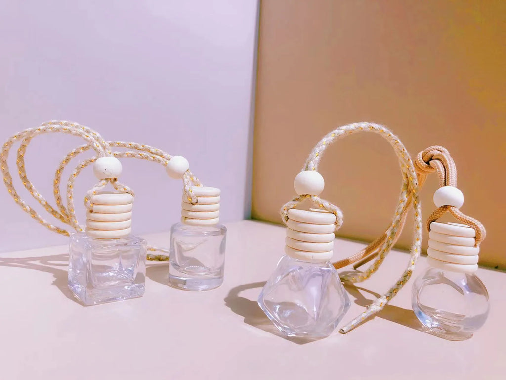 Glass car perfume pendant fragrance showing cylinder, diamond, flat drum and square container style options