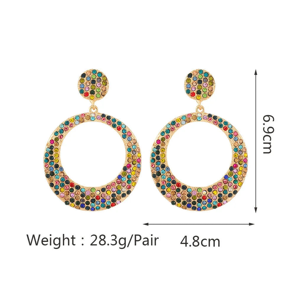 Colourful large round pendant earrings with metal diamond accents in cartoon style