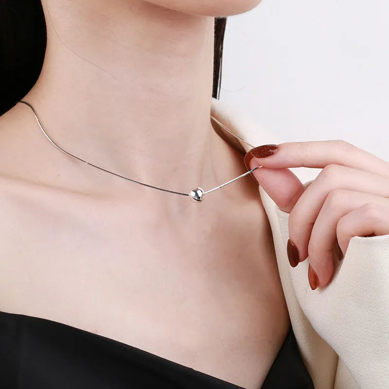 Small spherical pendant silver clavicle chain necklace with round elements and 925 sterling silver construction