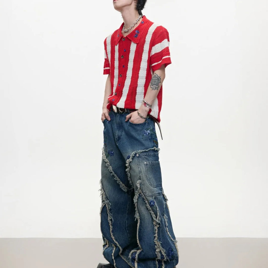 Man wearing a red and black patchwork striped retro knitted short-sleeved shirt in a loose fit.