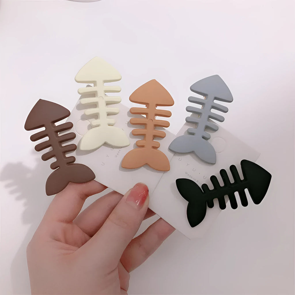 Fishbone pattern plastic barrette with duckbill clip in minimalist candy colour