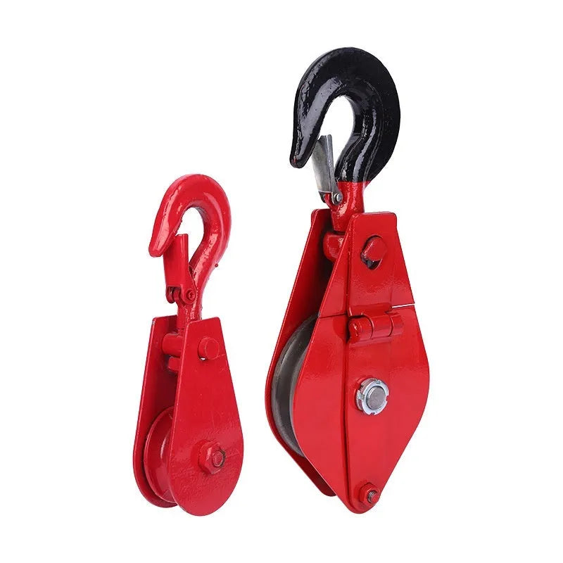 Red industrial lifting pulley with a forged steel safety latch hook and wire rope wheel.