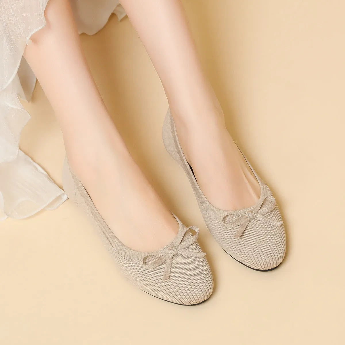 Women's round toe fabric flat pumps with bow detail and oversleeve design in butterfly black colour