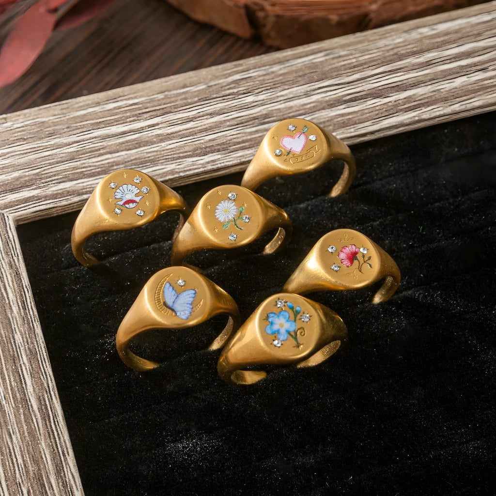 New Flower Stainless Steel Light Luxury Painted Ring in geometric shape with floral motif, available in multiple colours including Daisy and Peach Pink
