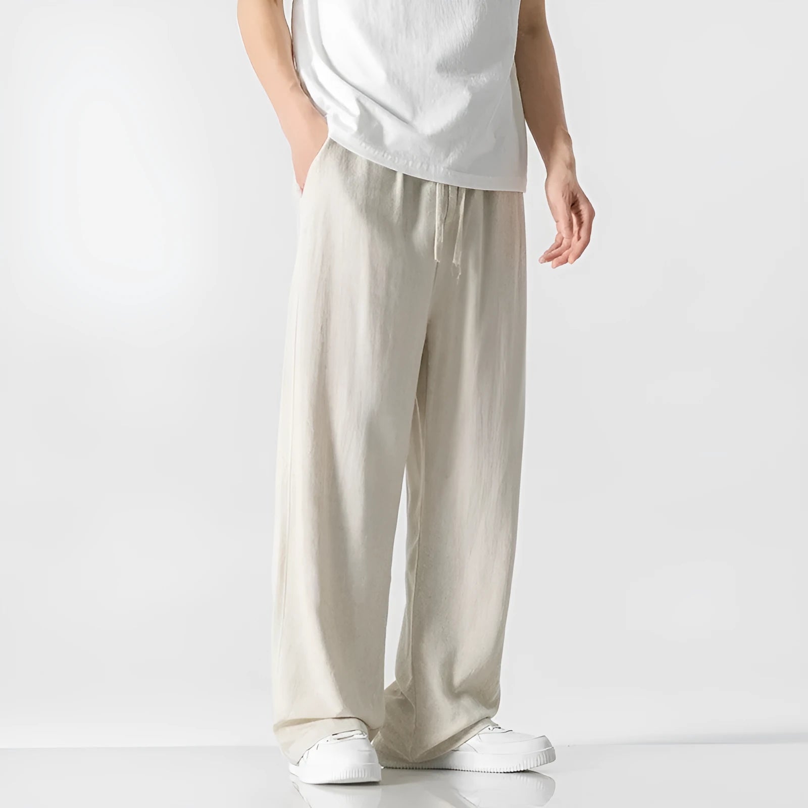 Men's straight-leg casual trousers in beige bamboo fibre fabric with a drawstring waist.