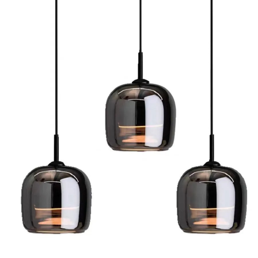Italian minimalist glass chandelier with tricolor light in a dining room setting