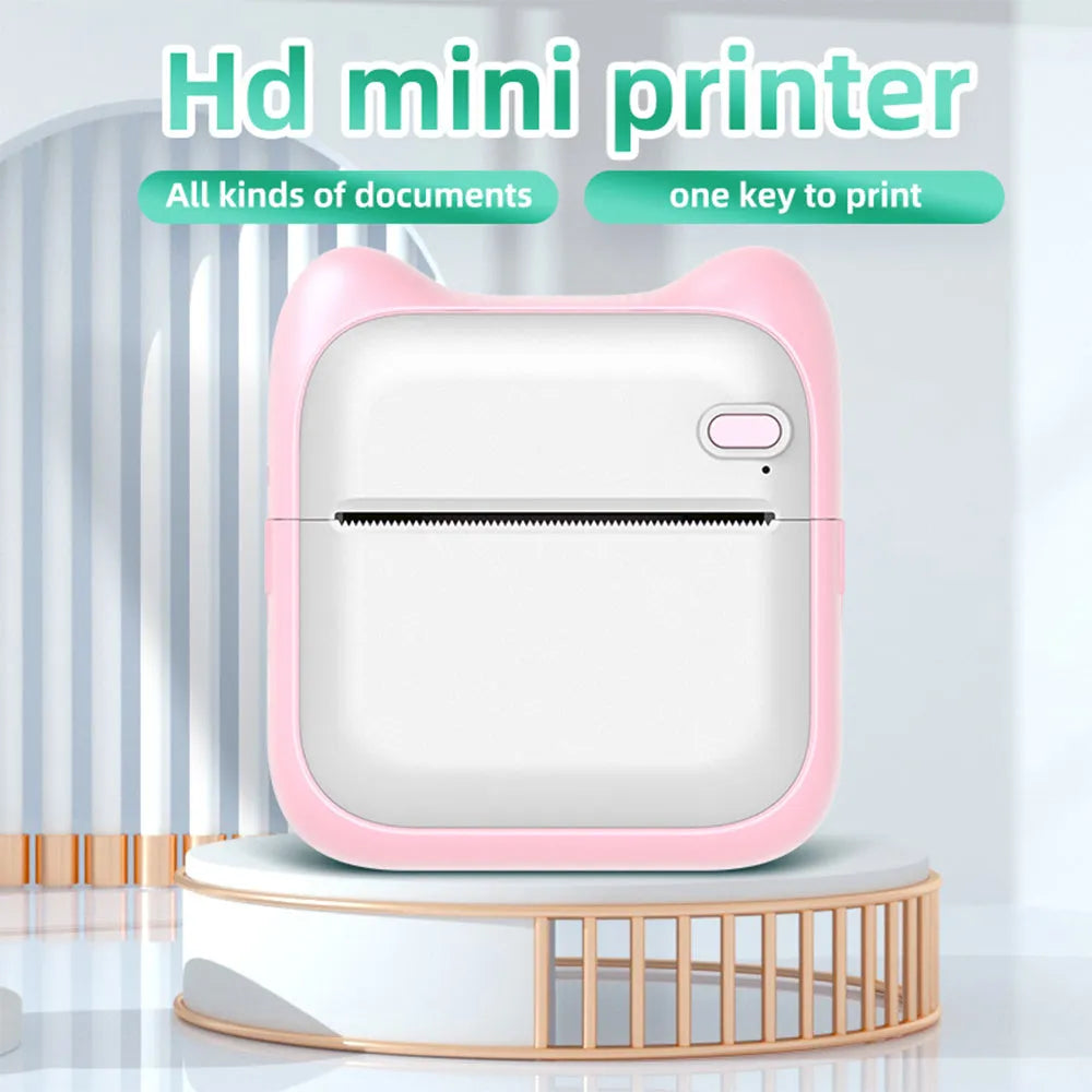 Pink mini pocket Bluetooth thermal printer measuring 90x45x82mm with USB charging cable