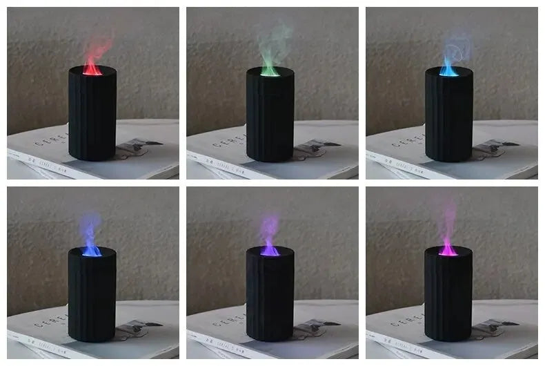 Black and white flame effect essential oil diffuser and air humidifier with coloured LED lights on a wooden table.