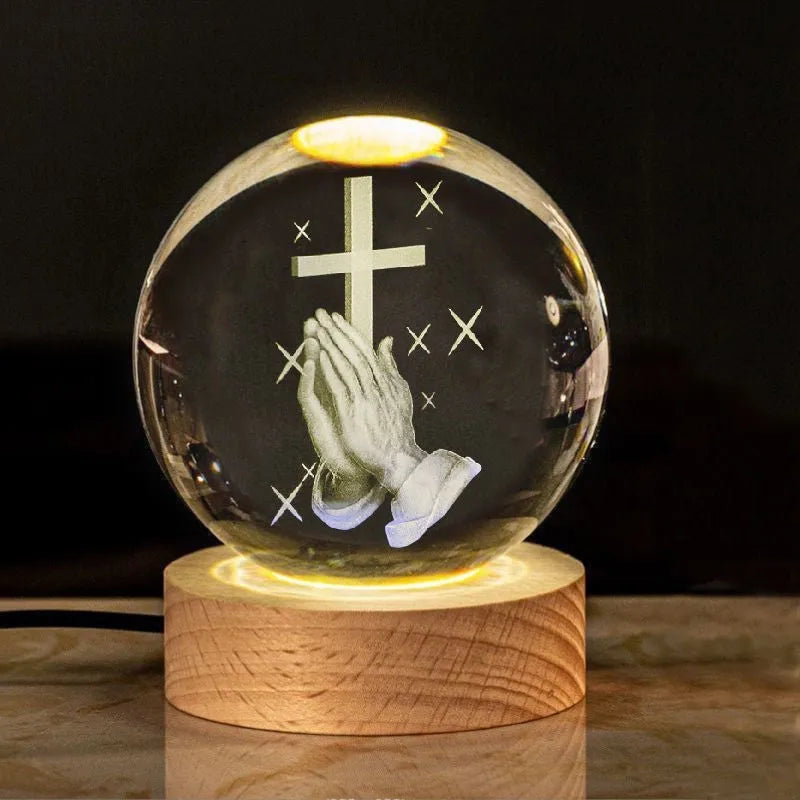 White crystal ball desk ornament with wood base and religious design inside