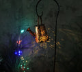 Solar garden lamp with tapered butterfly pattern iron frame and white LED light