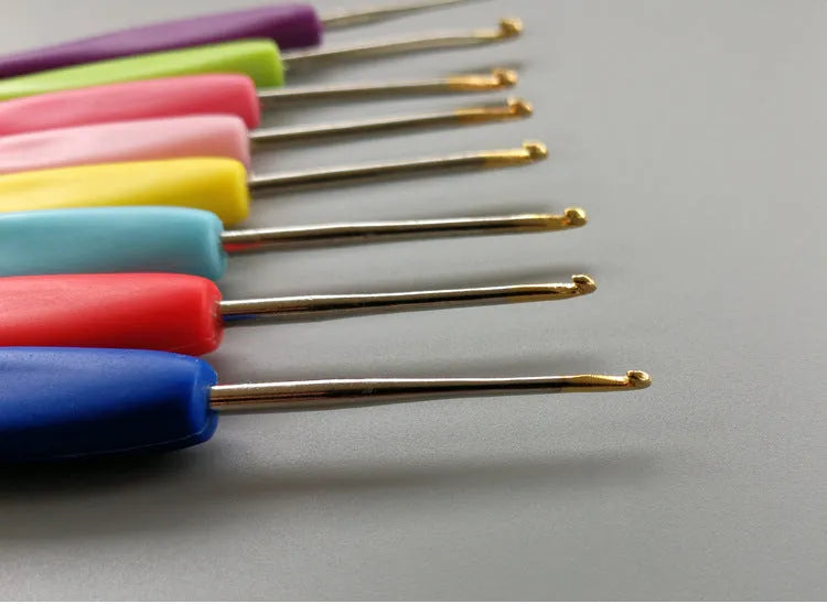 Complete set of 16 crochet hooks with soft and hard handles, sizes 1.0mm to 6.0mm, inside a grey PU storage bag.