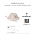 Beige wine bottle-shaped camping lantern with USB-C port and three light mode gear.